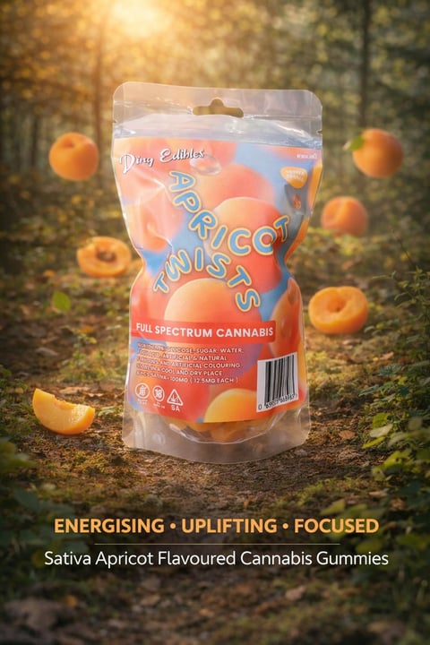 Package of apricot-flavored cannabis gummies with full spectrum label, displayed on forest ground surrounded by apricots